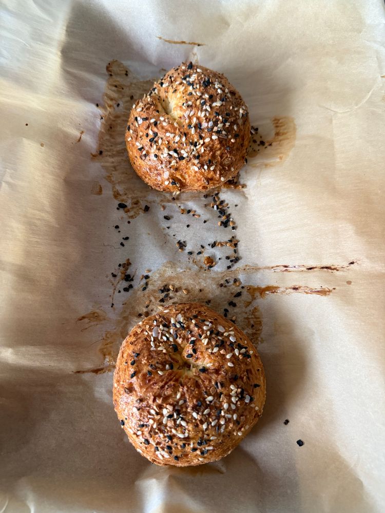 Cottage cheese bagels with everything seasoning on parchment paper 