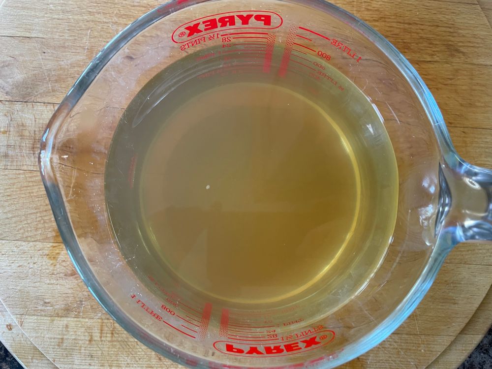 A completed dashi/fish stock in a jug.