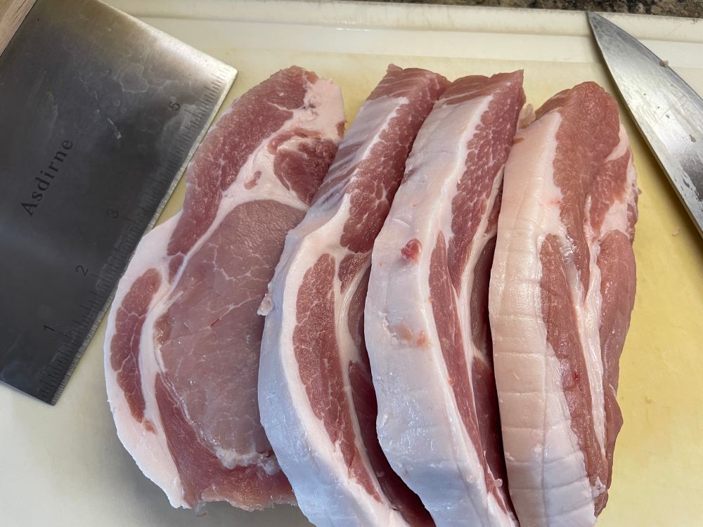 A pork loin joint cut into 4 x 1 inch thick steaks.