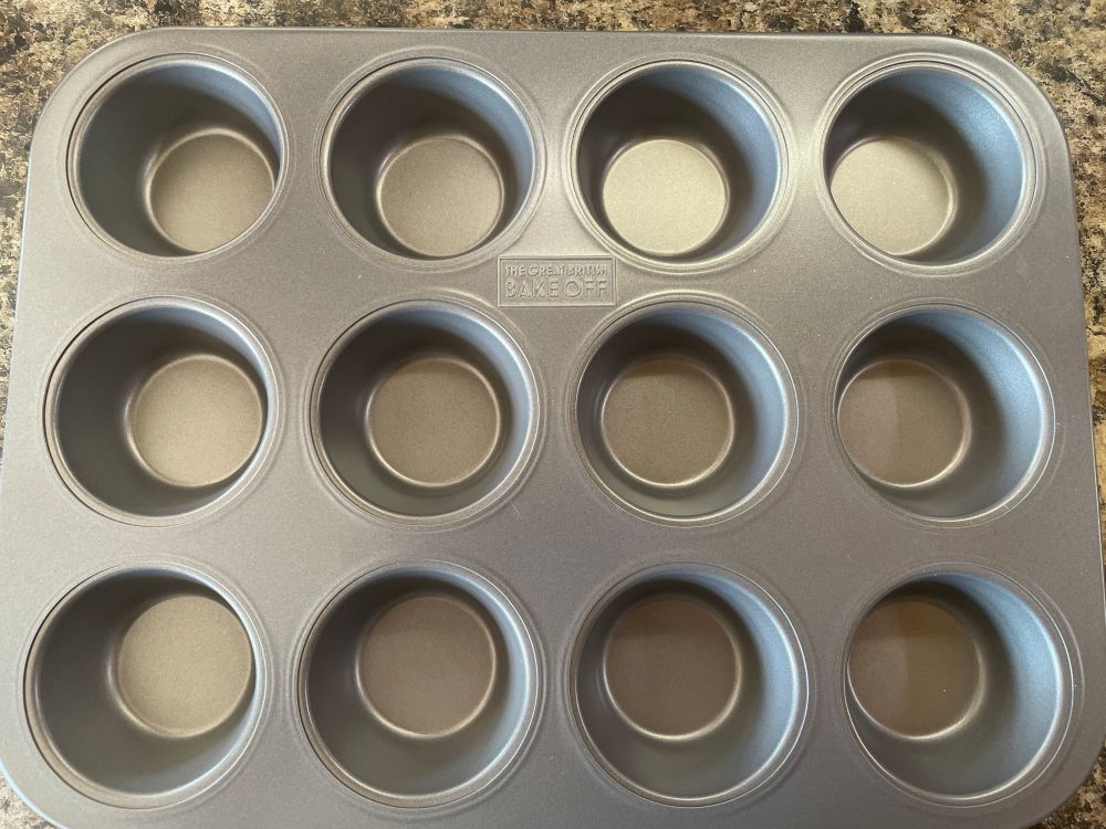 A shiny new muffin tin for 12 muffins, cupcakes or Yorkshire puddings.