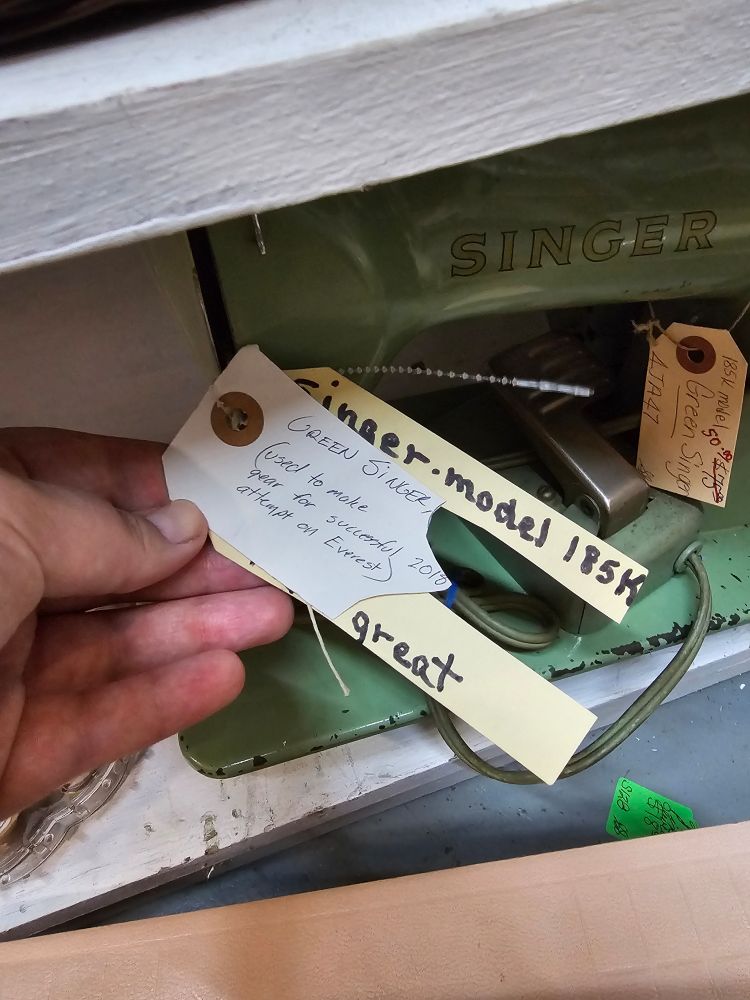 Note on a green singer sewing machine that it was used to make gear for a successful 2018 attempt on Everest.