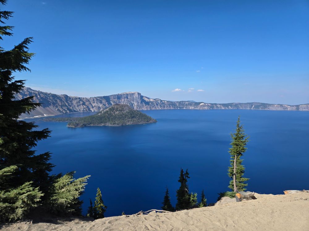 A photo of Crater Lake and Wizard Island taken from the rim trail