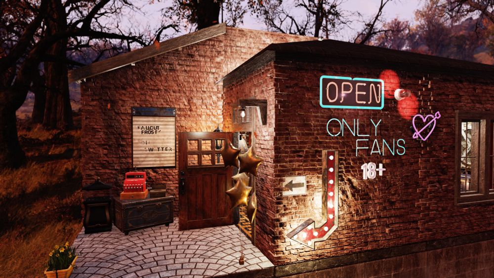 A screenshot from fallout 76z a small brick camp building. On the outer wall, an open sign and red klaxon light flashes. In neon blue lettering, it states “only fans.“
A marquee light points to the entrance. A neon heart sign and a sign that says 18+ Aldo adorn the wall. Gold Star shaped Mylar balloons are on the porch along with a red cash register atop a stash box.