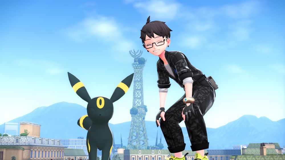 ポケモンZA：ミアレタワーを背景に、主人公とブラッキーが並んでいるところ