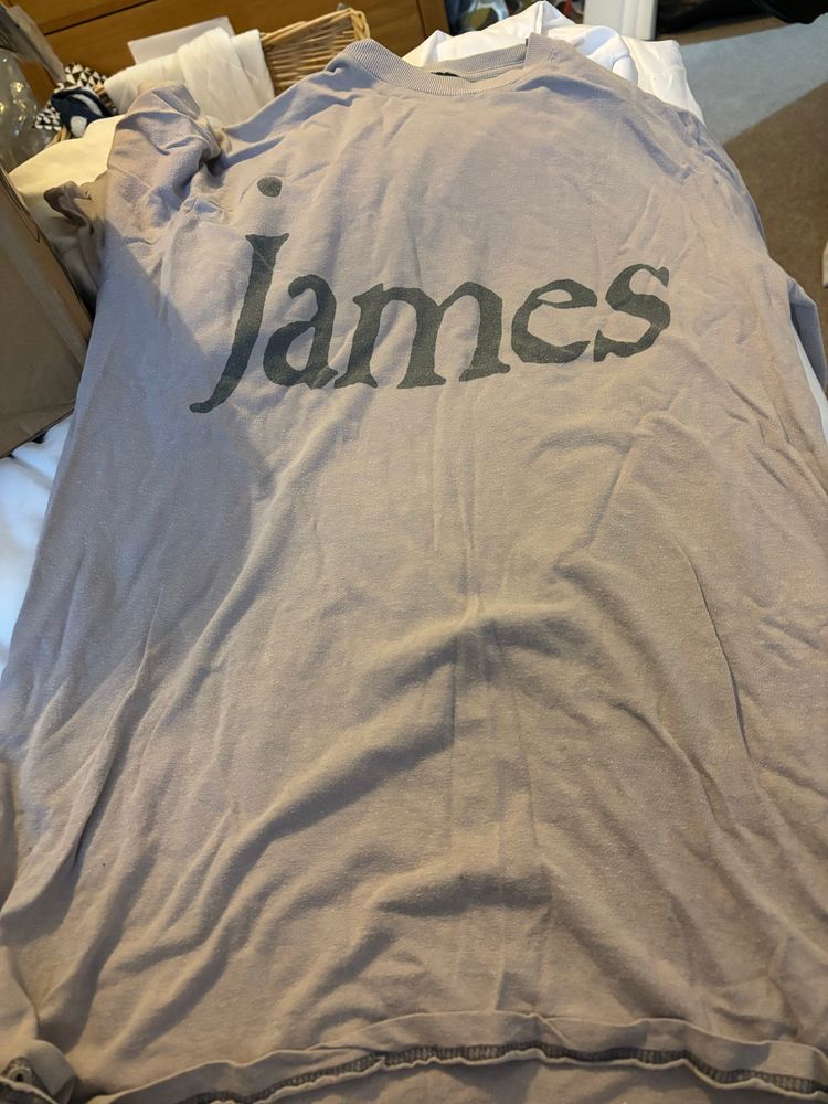 T-shirt with James printed on front 
