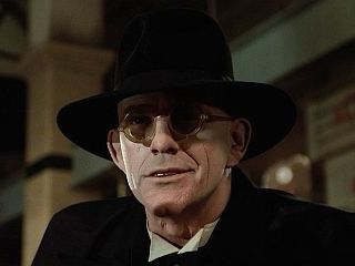Judge Doom from Roger Rabbit, smiley with mild satisfaction on account of he just solved “the trolley problem” by replacing LA’s trolley system with “The Freeway”