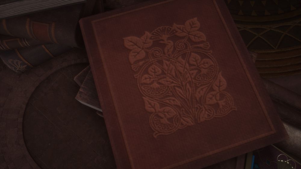 A red book decorated with leaves
