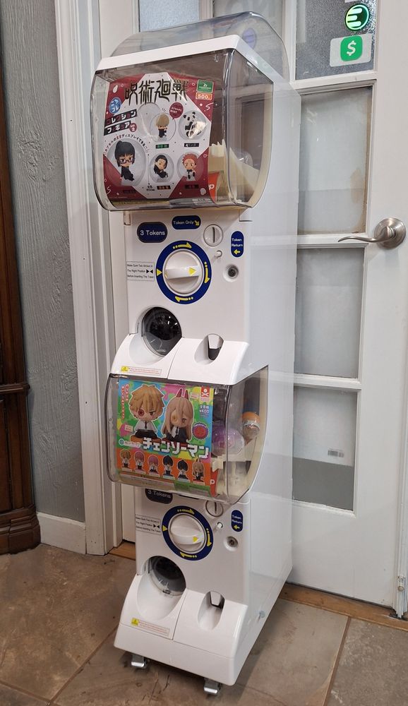 A picture of a double stacked Capsule toy vending machine.