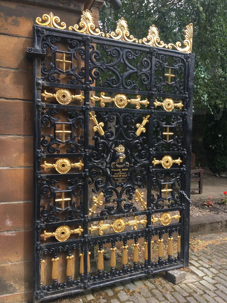 One of the gates of Glasgow Necropolis, conserved, painted, and gilded in 2011, and still looking lovely. Designed by the architect David Hamilton.