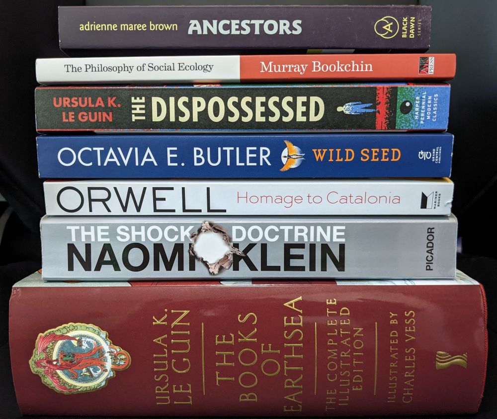 Summer reading stack: The Books of Earthsea, The Shock Doctrine, Homage to Catalonia, Wild Seed, The Dispossessed, The Philosophy of Social Ecology, Ancestors