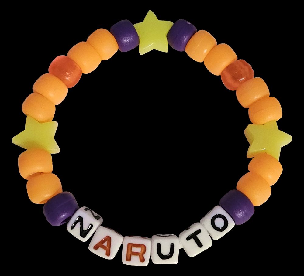 A transparent png of a single row kandi bracelet that says "Naruto."