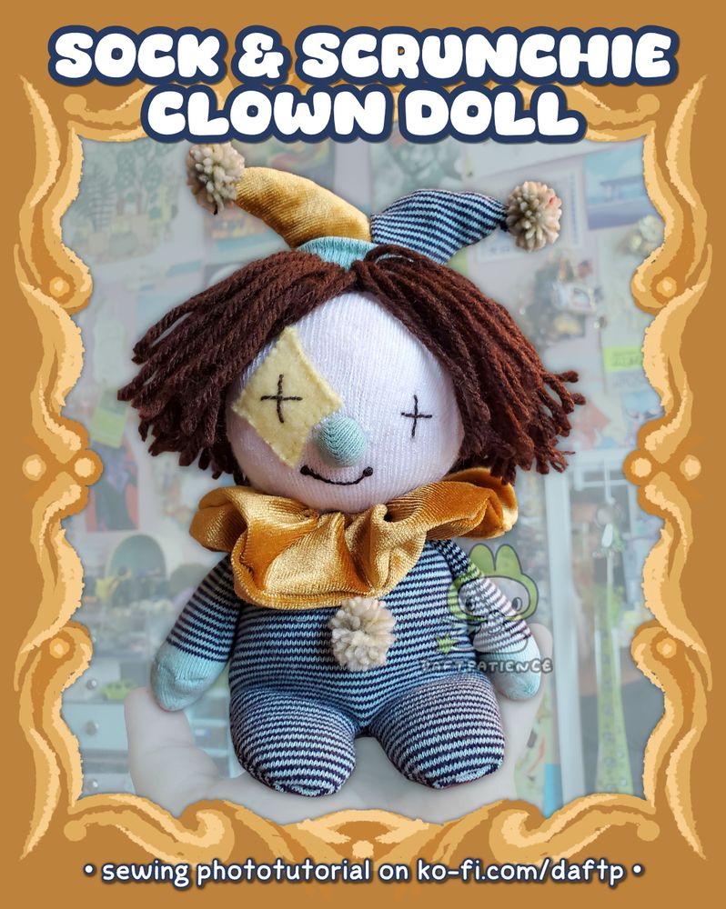 a photo of my sock & scrunchie clown doll. he's plump and soft looking with a teal stripey body and gold neck ruffle. he has brown yarn hair and a gold star accent on his face. he has a classic double pointed jesters' hat in the same material as the body and ruffle, and he has pale pompom accents on his hat and body.