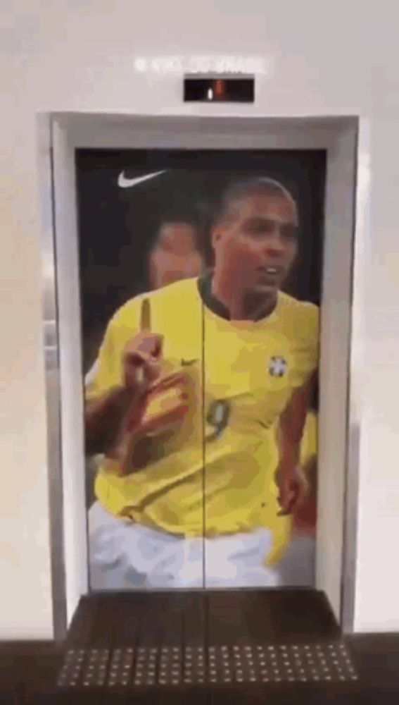 an elevator with a picture of a soccer player on the door