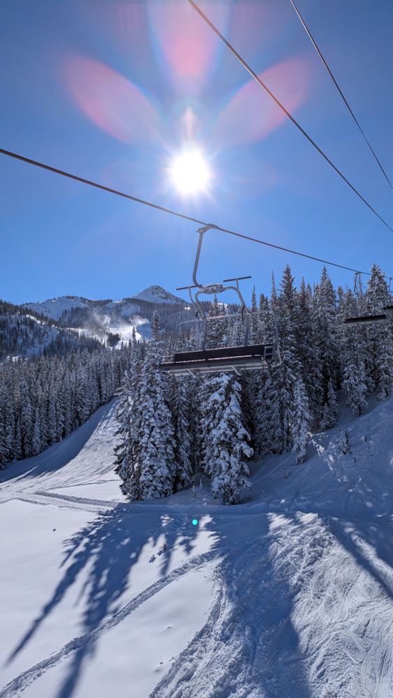 View from a chairlift on a bluebird day