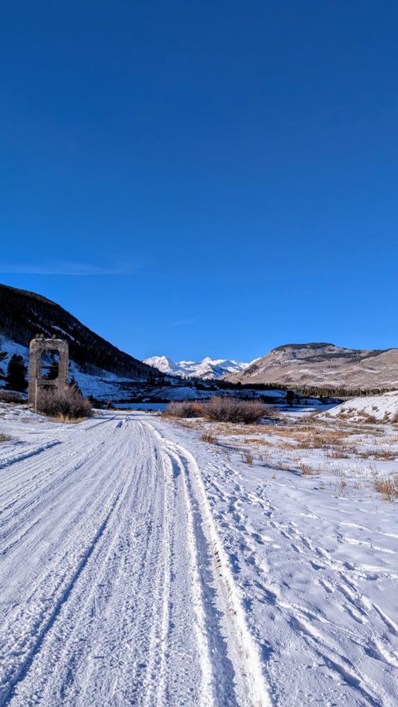 Snow covered road leading to paradise