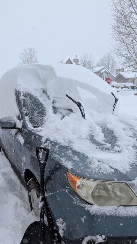 Shot revealing just how much snow accumulated on my car over night