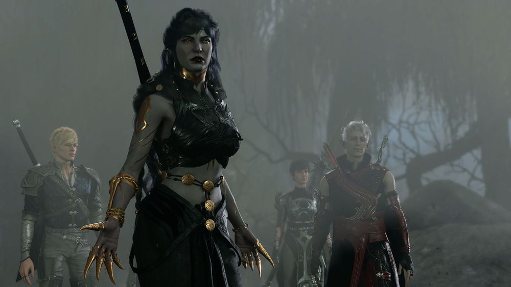 Lu (durge) is wearing all black semi-traditional drow armor with gold accents. Lu's body is covered in intricate gold body paint, and they're wearing gold gauntlets with claws. Auryn (tav), Shadowheart, and Astarion are in the background.