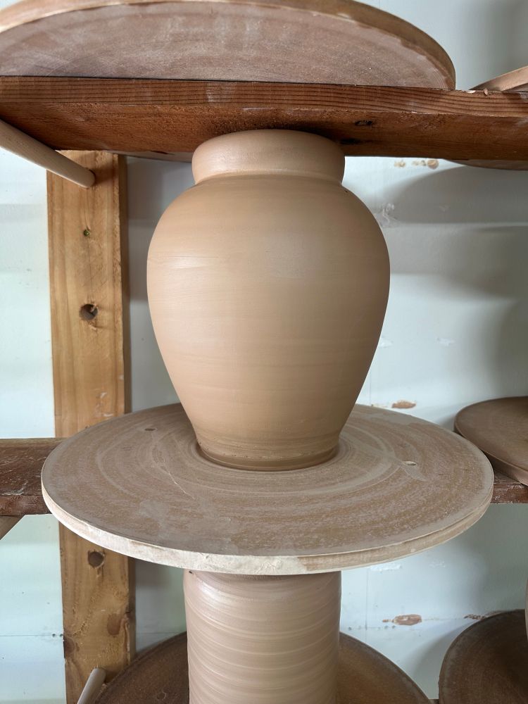 a stoneware vessel fresh off the potters wheel. 