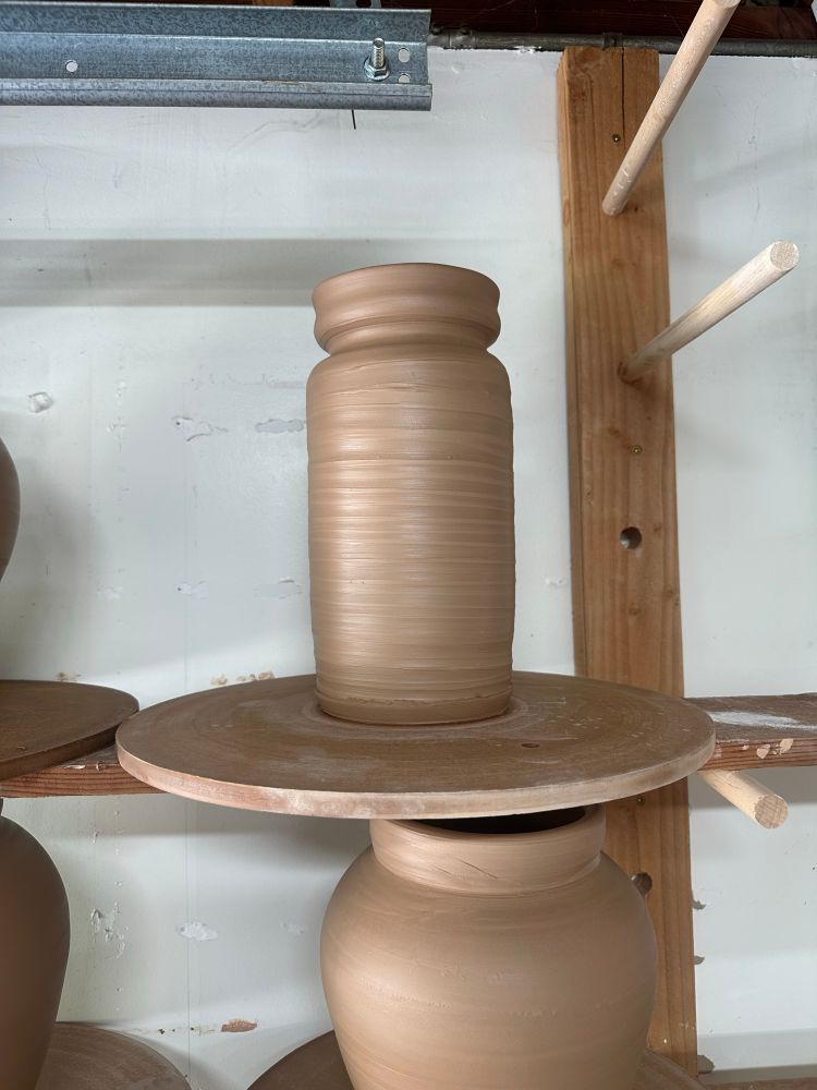 a stoneware vessel fresh off the potters wheel. 