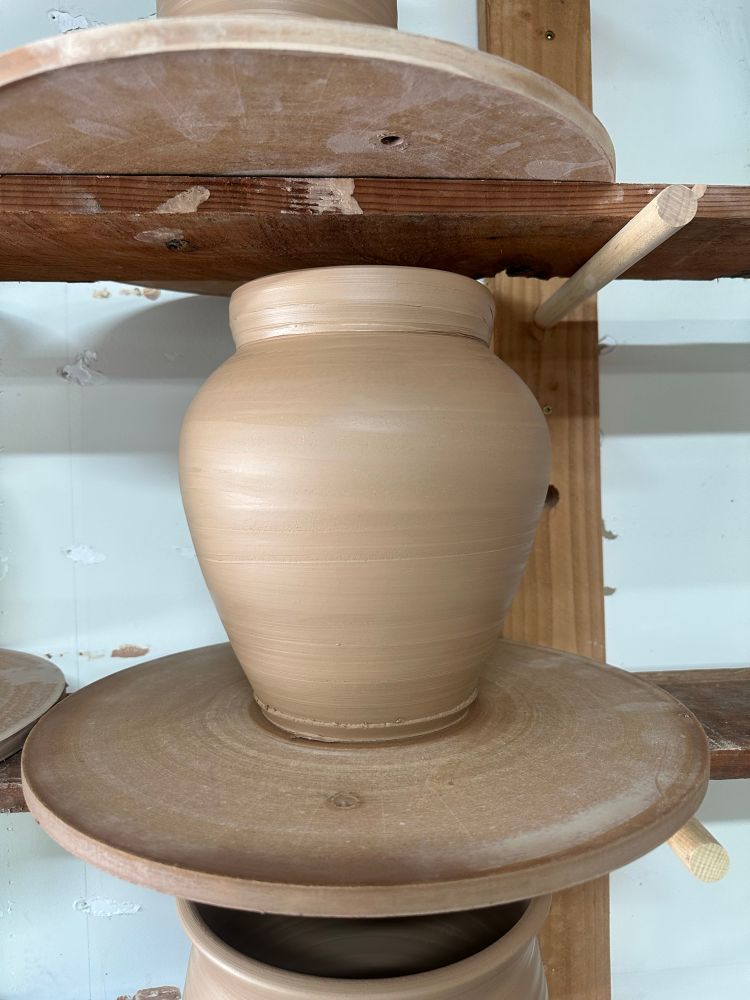 a stoneware vessel fresh off the potters wheel. 