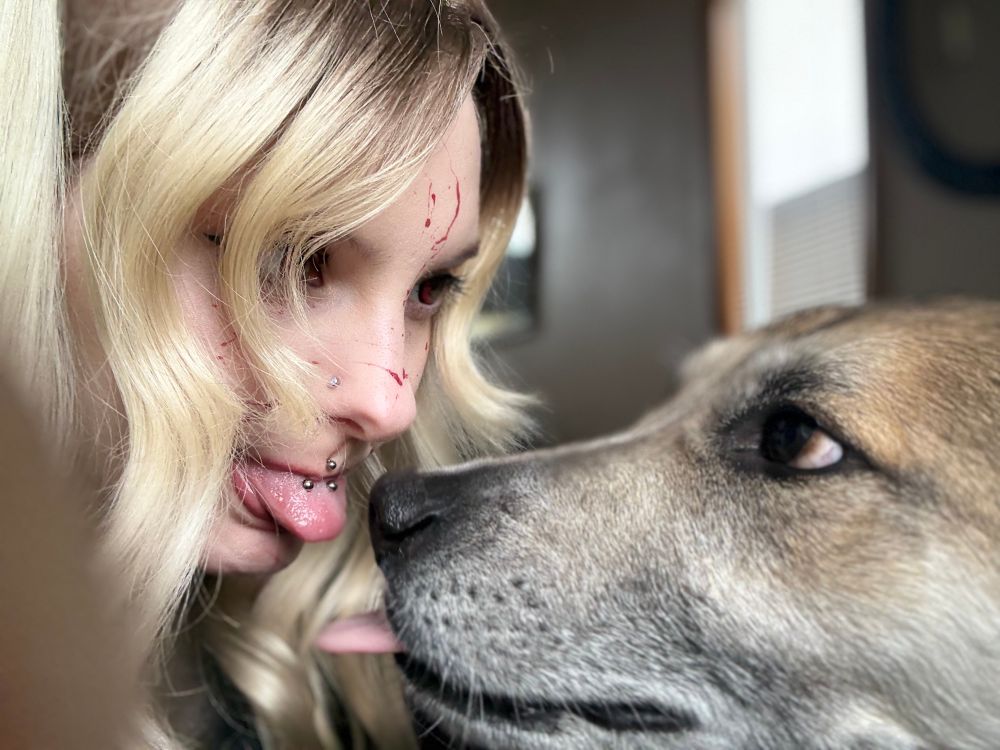teela and i sticking our tongues out at each other 

do not worry she did not actually manage to lick me or my tongue i was marked safe from dog drool
