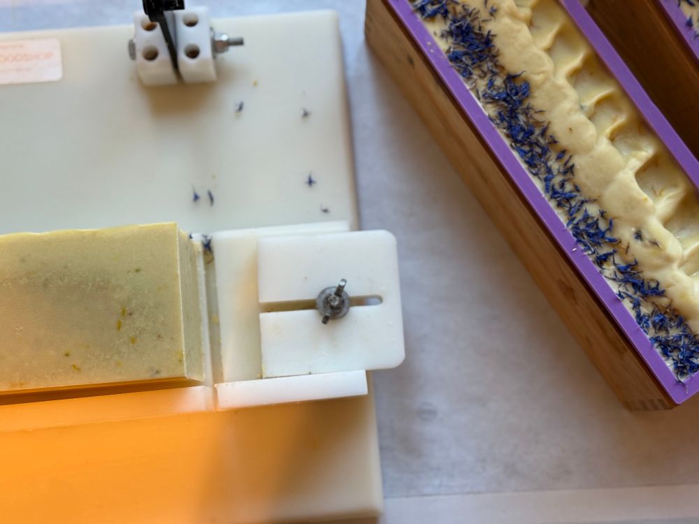 Soap loaves in mild and being cut 