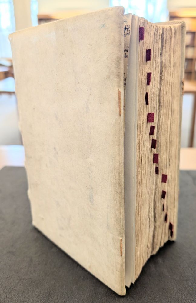 Front cover and fore edge, complete with added red tabs to mark textual divisions, of a mid-15th century collection of pastoral and assorted works. Ohio State University, Rare Books & Manuscripts Library, Spec.Rare.MS.MR.Cod.97.