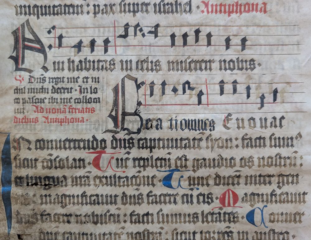 Detail picture of script on a late-15th century Choir Psalter produced in Würzburg, Germany, with musical notation and decorative initials in red and blue.