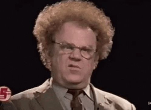 a man with curly hair and glasses is making a funny face .