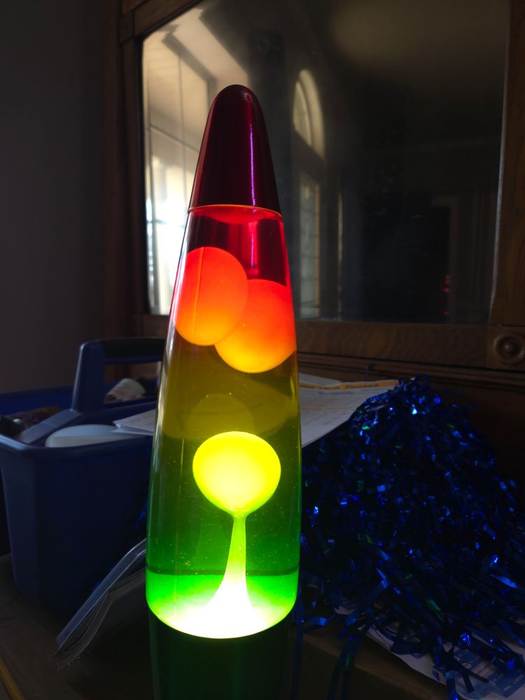 A "lava lamp" (glass tube with mostly water and some wax that rises and falls through the water making a pretty visual effect) 
