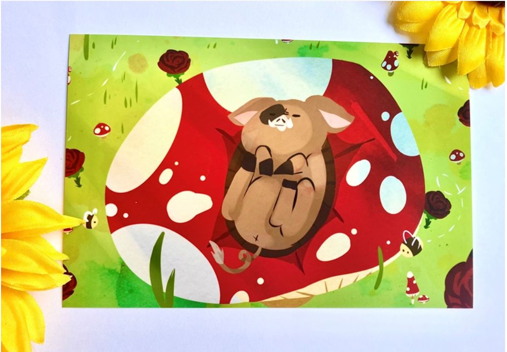 Print of our little pig character Gilbert lying on a huge mushroom in a grassy field
