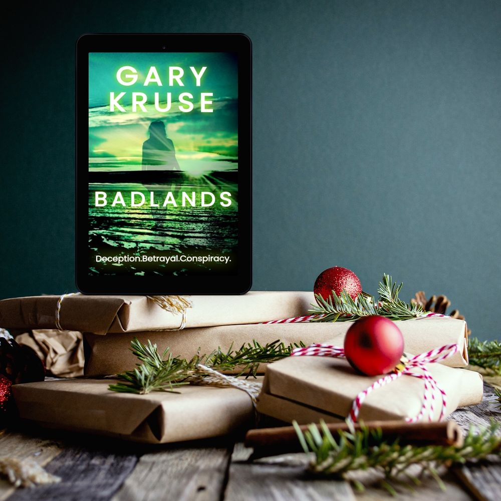 An ebook reader showing the cover of Badlands on a pile of presents. 
