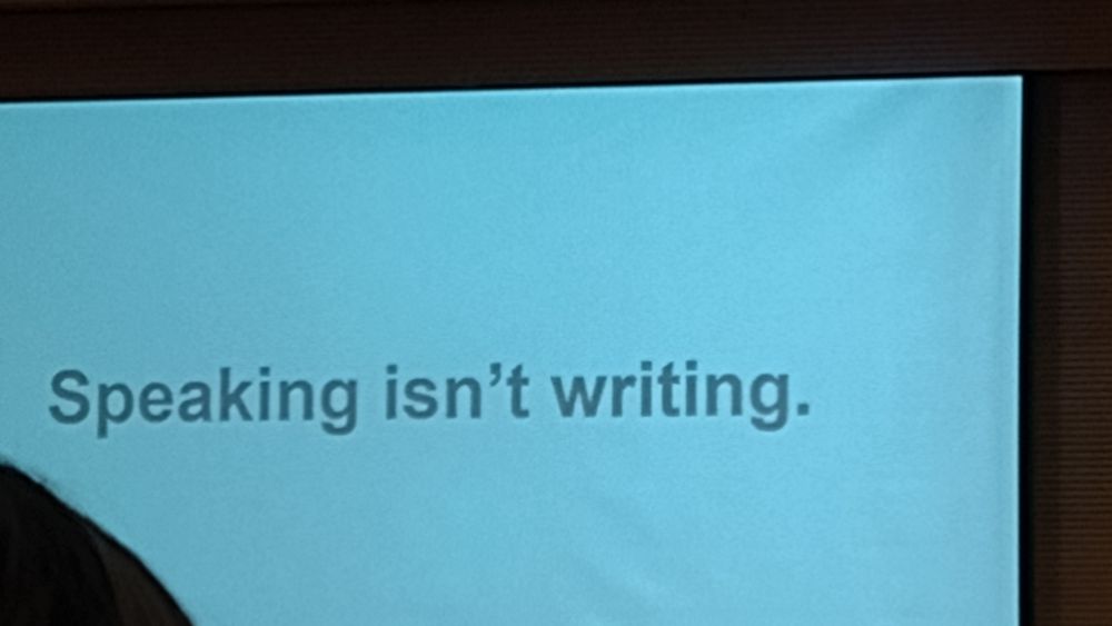 Photo of Rob Drummond's slide. It says, 'Speaking isn't writing.'