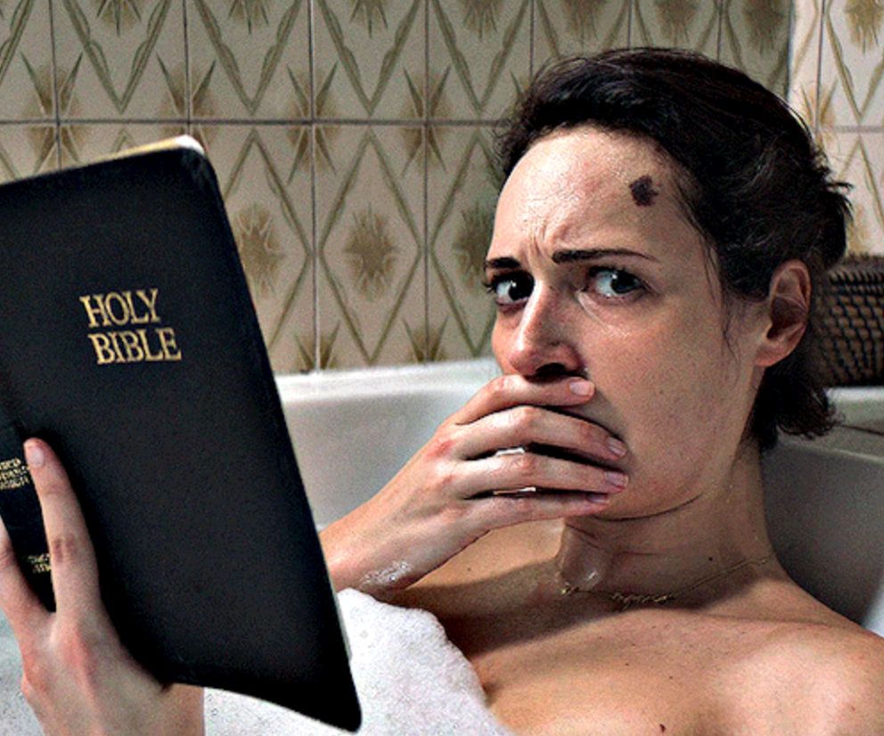 A "Fleabag" screencap that depicts a white brunette woman in the bathtub, reading a Bible.  She looks aghast at the camera with a hand over her mouth.