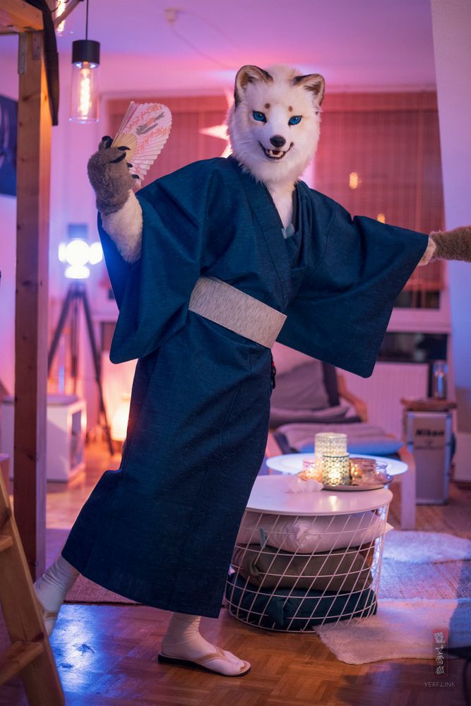 arctic fox in kimono with a bright smile 