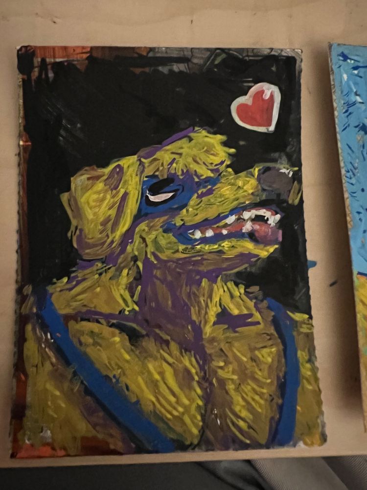 Small painting of a golden retriever man looking happy in front of a black background. There’s a cartoony heart in the top right