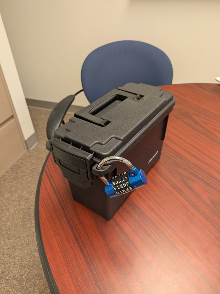 Plastic black ammo box locked with a 5-letter combination lock 