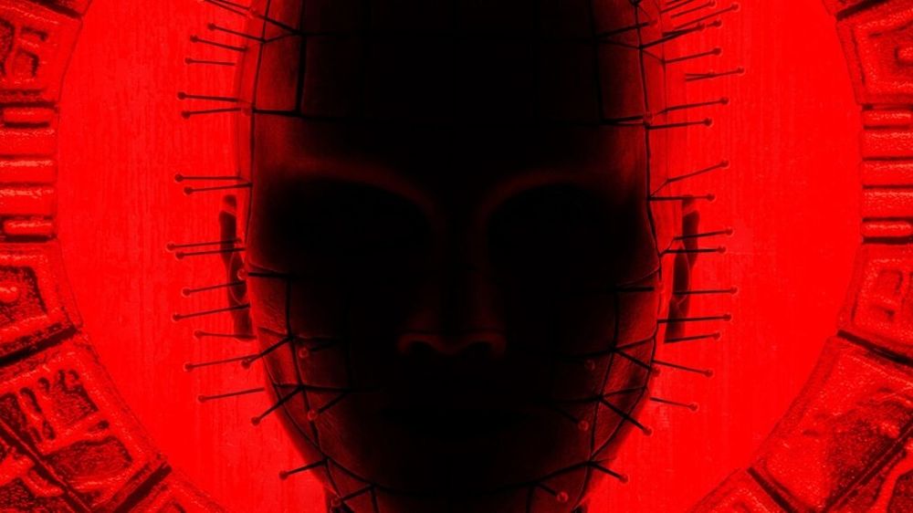 A silhouette of Pinhead from 2022s Hellraiser against a red background 