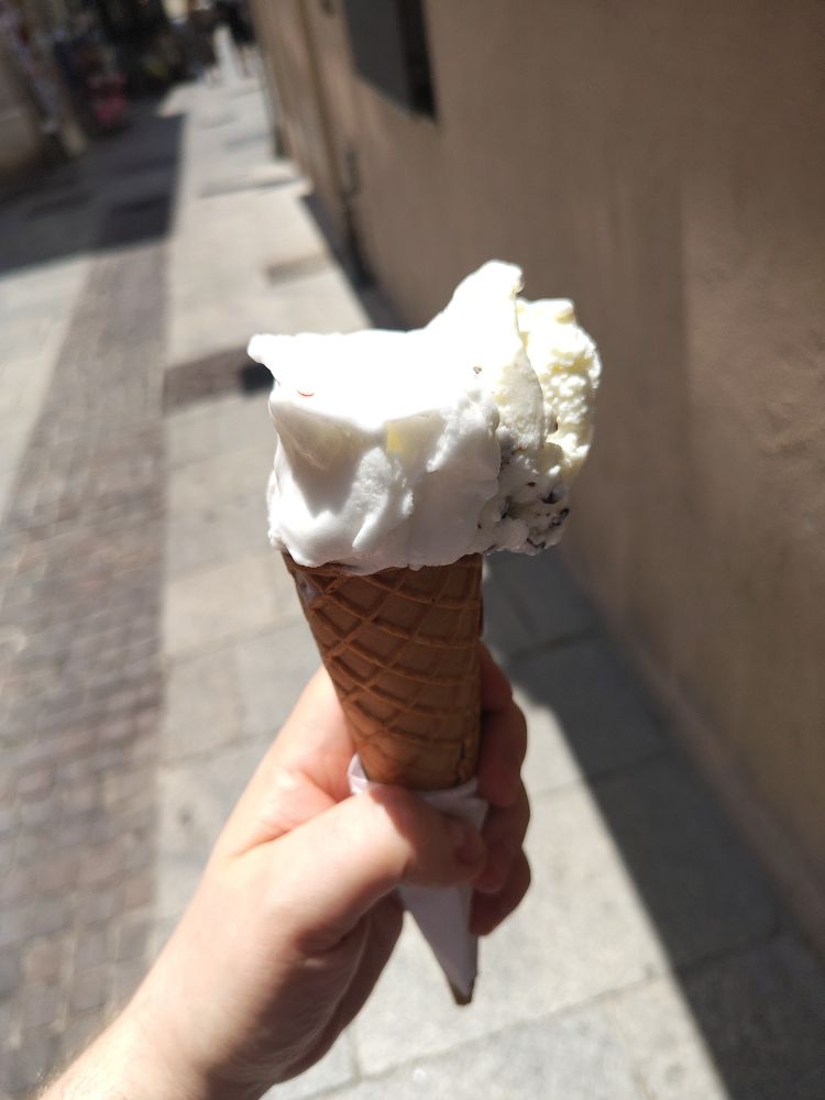 An image of a cone of gelato, lemon and stracchiatella flavours. It tasted phenomenal 
