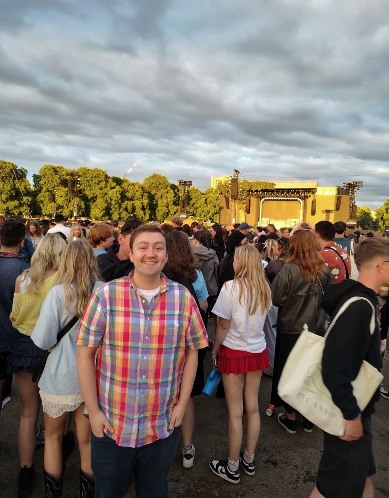 Shot of me among a very large crowd with clouds in the sky