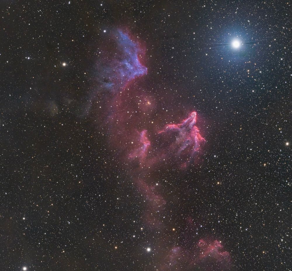 IC 63 - The Ghost of Cassiopeia

About 550 light-years away in the constellation of Cassiopeia lies IC 63, a stunning and slightly eerie nebula. Also known as the ghost of Cassiopeia, IC 63 is being shaped by radiation from a nearby unpredictably variable star, Gamma Cassiopeiae, which is slowly eroding away the ghostly cloud of dust and gas.