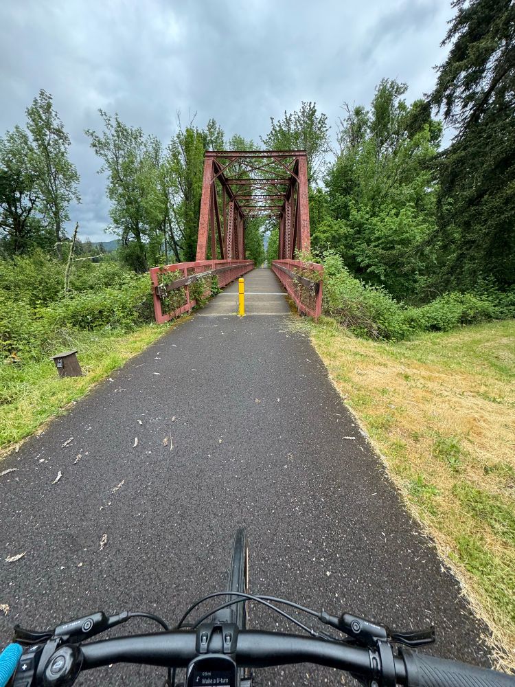 A beautiful bike path leading to a railroad-style trestle bridge in Cottage Grove Oregon