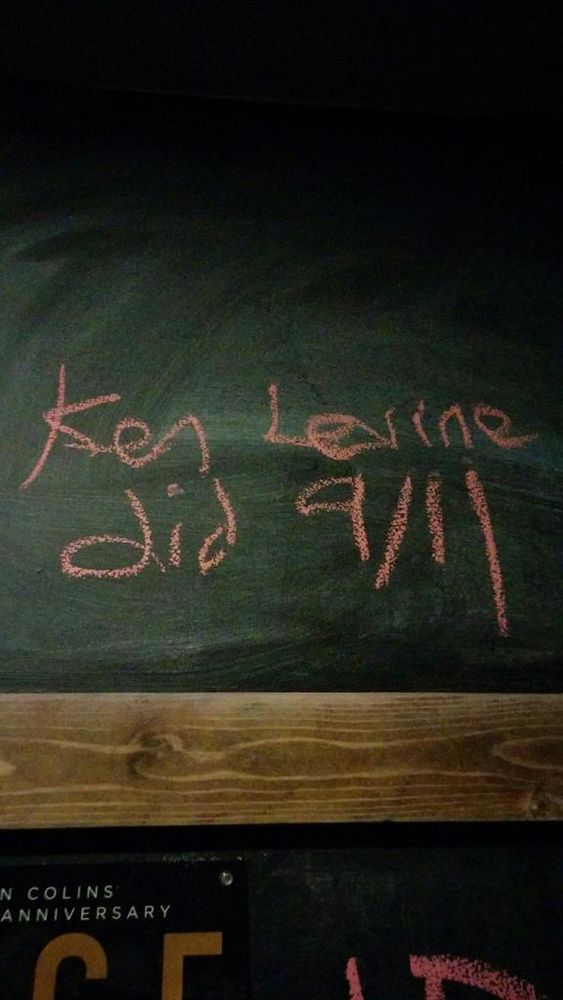 salmon chalk on black slate: "Ken Levine did 9/11"