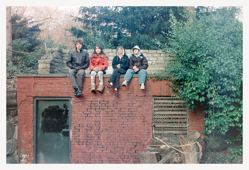 Cool kids drinking beers on top of a storage/maintenance building in Prospect Park (shot with permission)