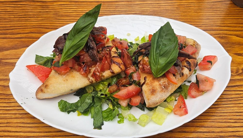 Sardines on sourdough bread with a tomato based salad 