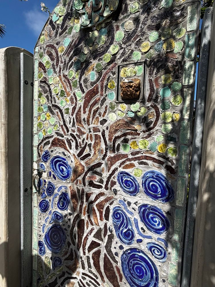 A concrete door with tile and stone in lay with a little bit. Nest 