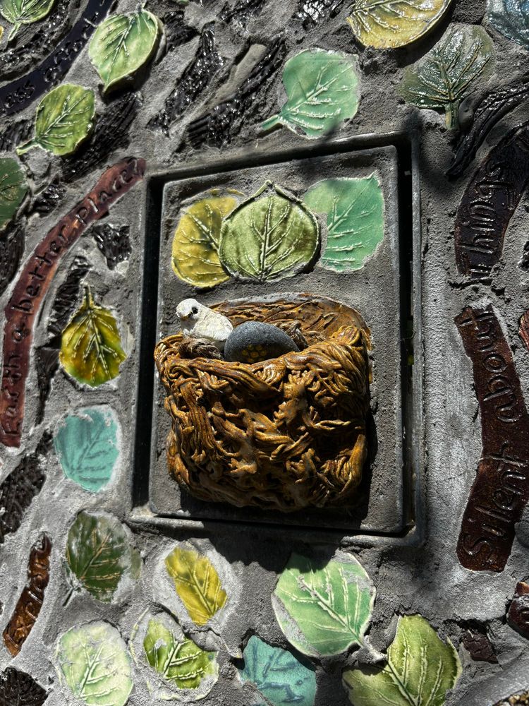 Stone bird nest with a stone egg and a stone bird 