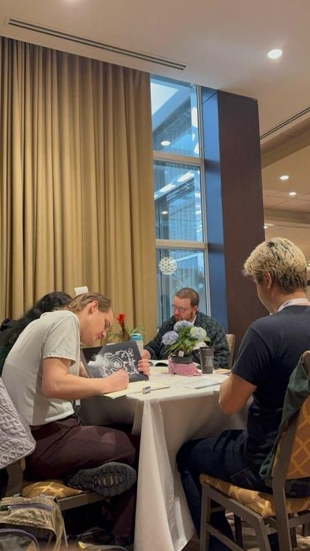 Players engrossed in the game at the table