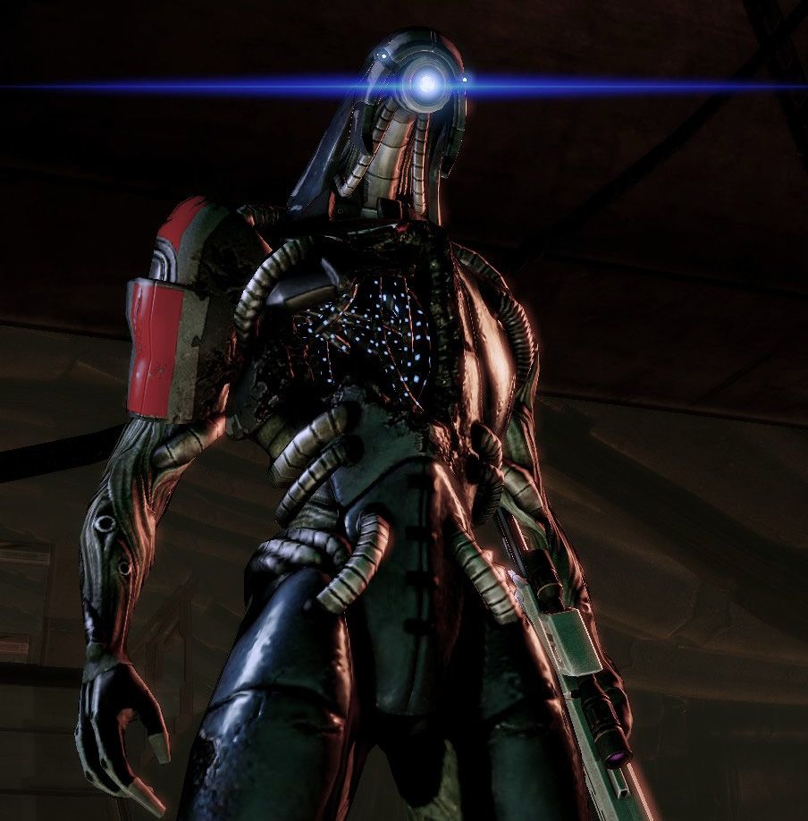 An image of Legion an artificial intelligence powered robot from Mass Effect 2/3 with a single light shining where a face would be and with an exposed chest hole with sparkling lights.