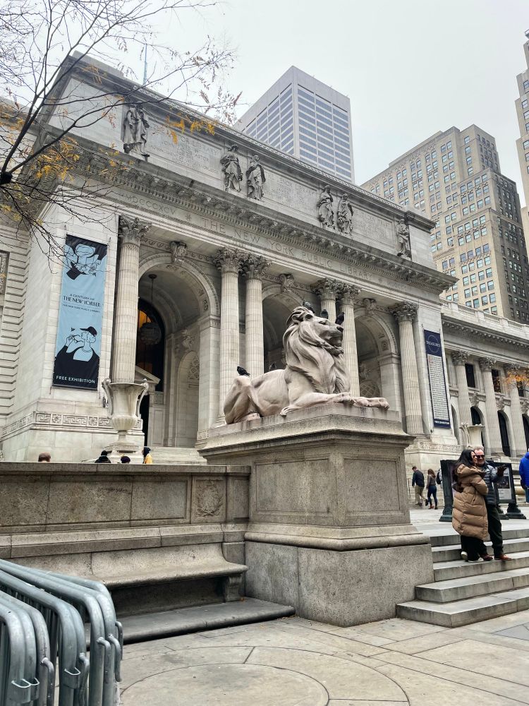 The New York Public Library. Image shows the facade of the building including a statue of a lion.